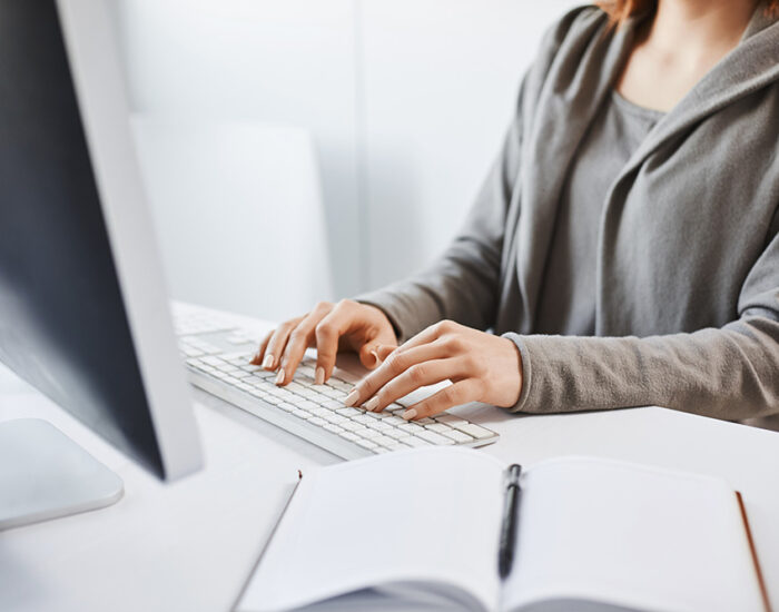 Working hard to party hard on weekends. Cropped shot of woman typing on keyboard
